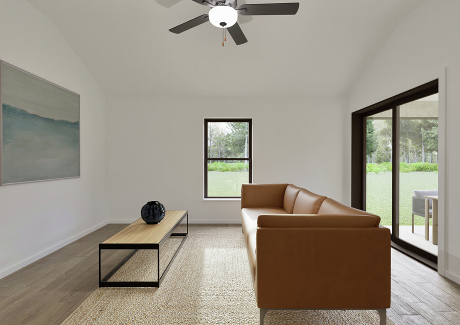 Minimalist living room with a brown leather sofa, wood coffee table, and abstract painting. Large windows offer a view of lush greenery outside.