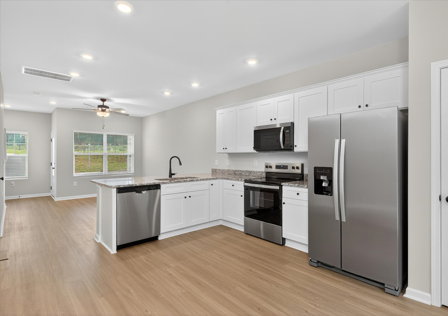 The kitchen comes with stainless-steel appliances. 
