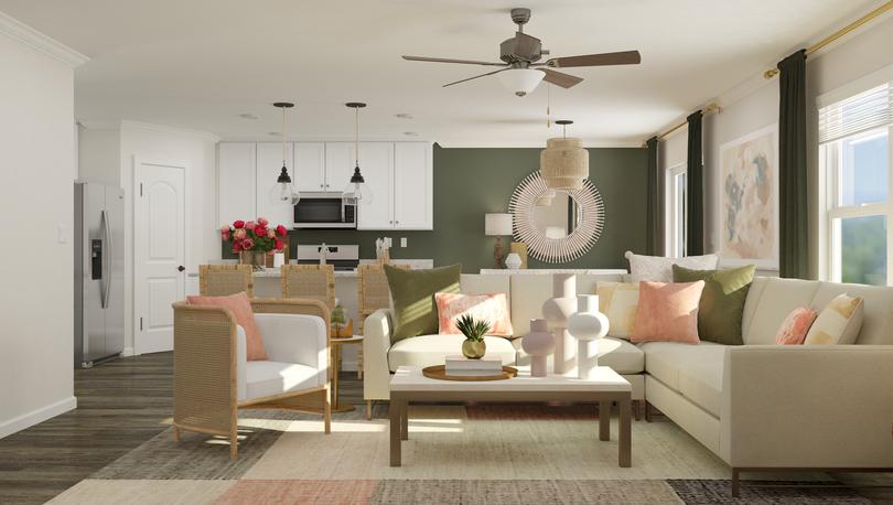 Rendering of the living room showcasing
  the open floor plan of this new construction home. In the foreground is a
  sectional, accent chair and coffee table. In the background the kitchen and
  breakfast area are visible.