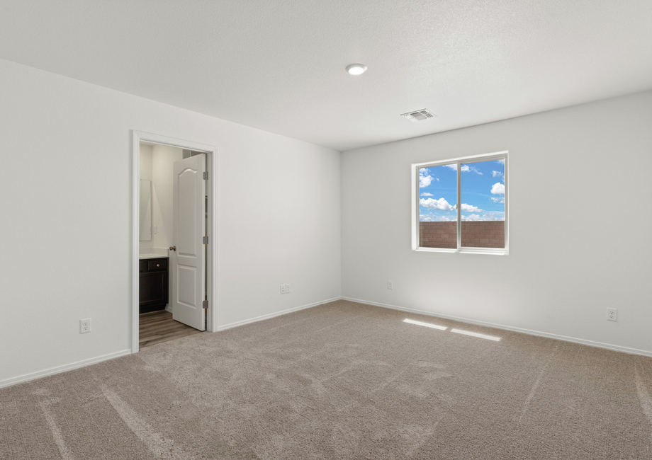 The master bedroom has an attached bathroom.