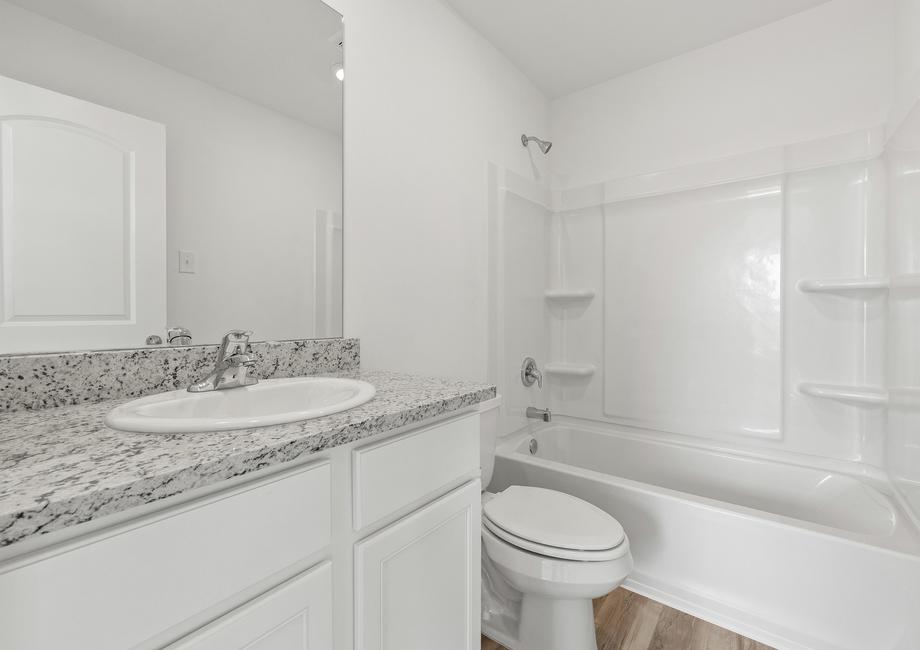 Each bathroom has granite countertops and a shower/tub combination