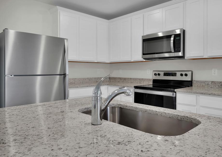 The kitchen comes with a full suite of stainless steel appliances!