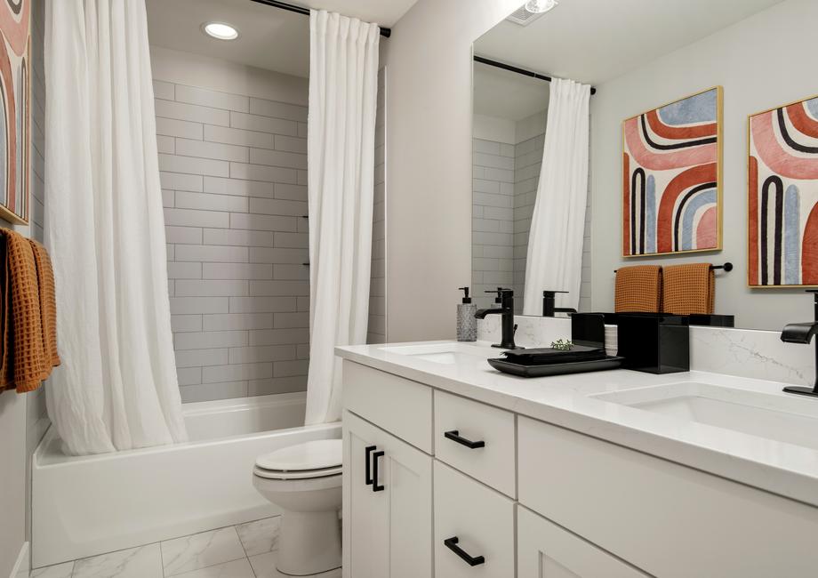 Large secondary bathrooms with plenty of storage.