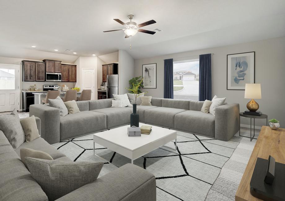 Staged living room with two large gray couches.