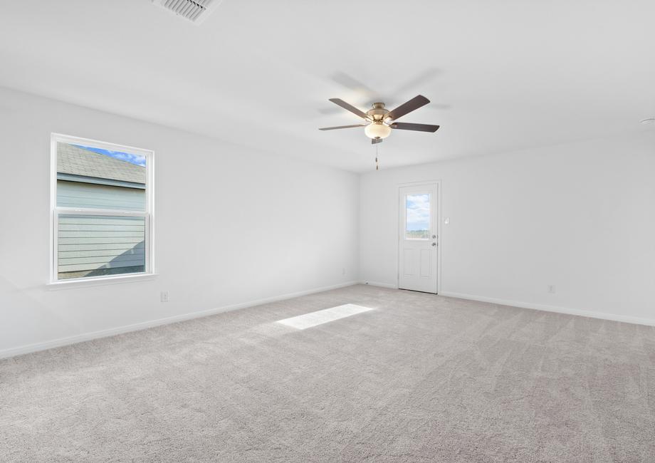 The family room has neutral carpet.