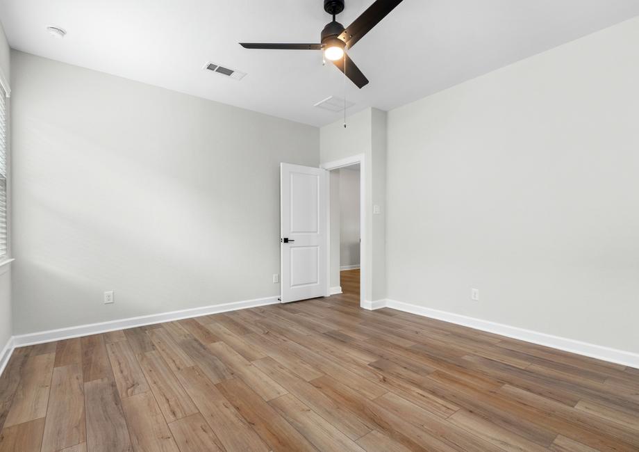 Natural light bathes the master bedroom.