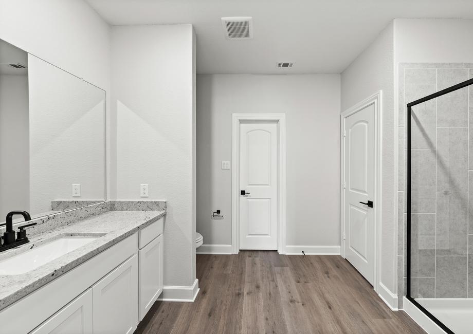 The master bathroom of the Sabine floor plan has a glass, walk-in shower.