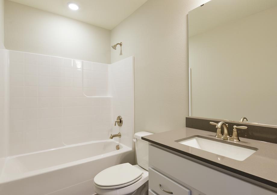 The secondary bathroom has a tub/shower combo.