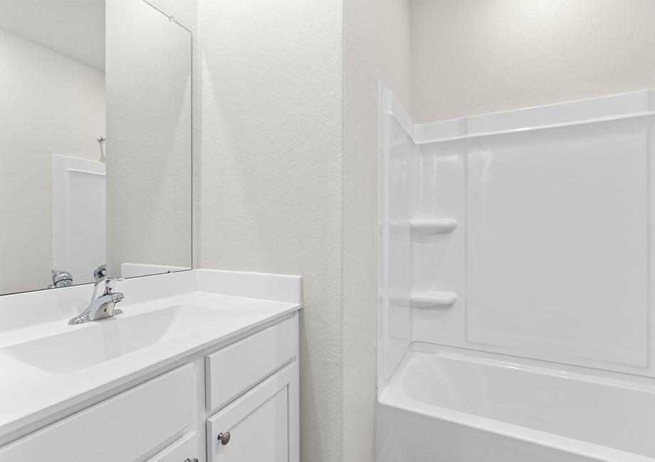 A secondary bathroom with a tub/shower combination