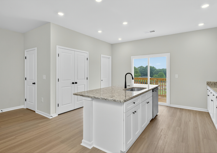The kitchen comes with stainless-steel appliances. 