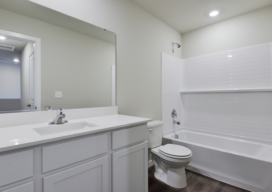 The secondary bathroom has a tub/shower combo.