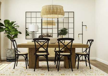 Rendering of dining room with
  a six-person table. This room also has three large mirrors on the wall and
  two plants in the corner 