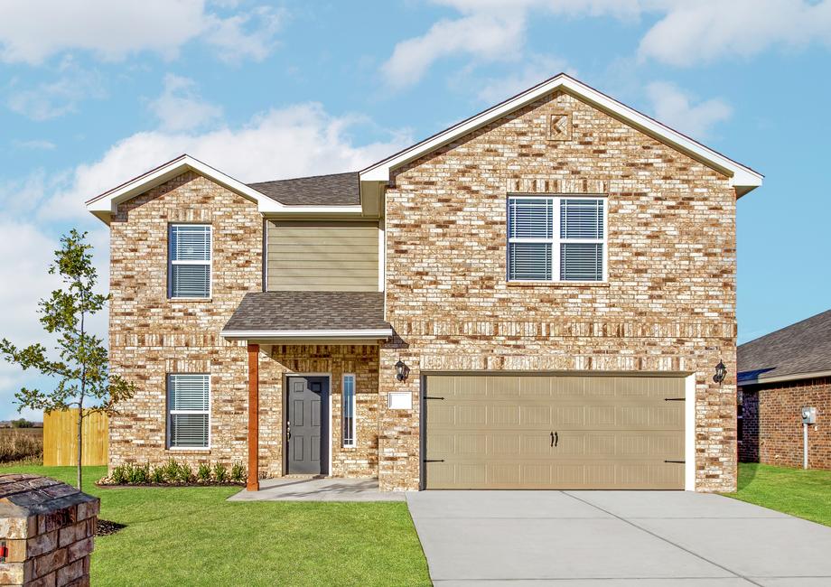 Beautiful two store home with a brick exterior and siding detail.