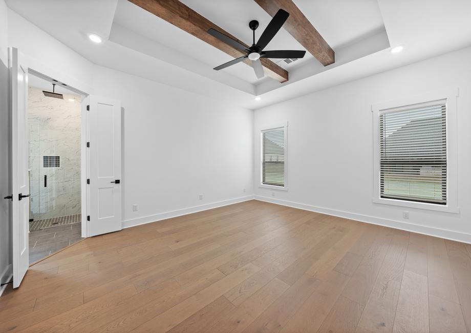 The peaceful master bedroom has two large windows that let in great, natural light.