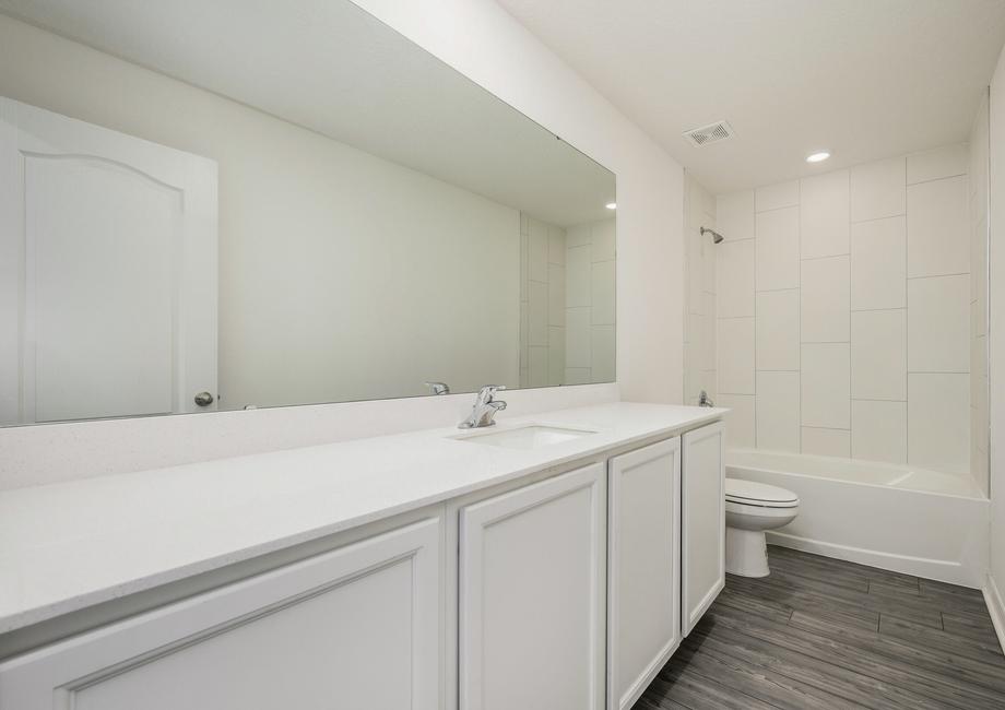 With an additional guest bathroom with an extra large vanity you are ready to host all of your guests