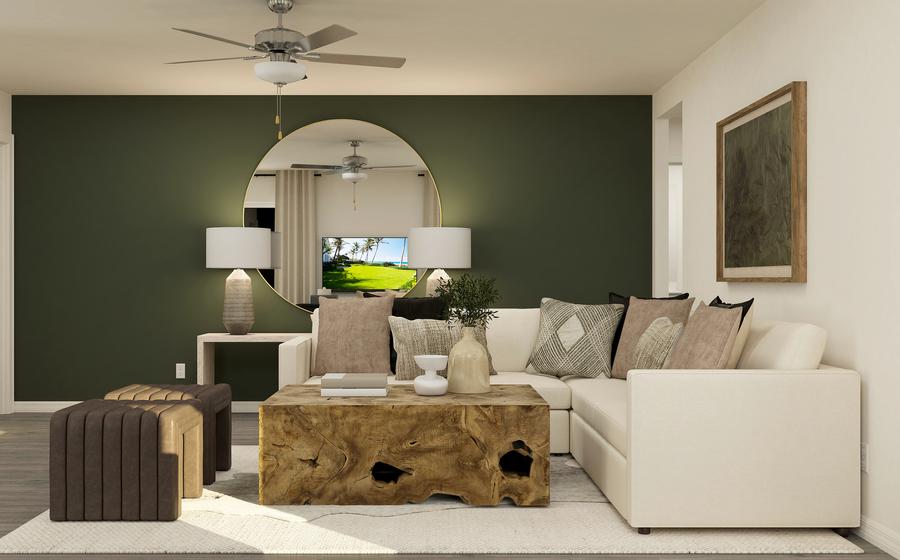 Living room with sectional couch and large mirror