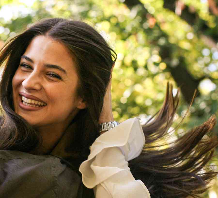 Couple laughing in the park.