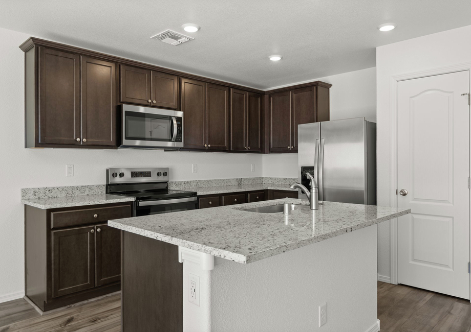 This kitchen comes with brand-new stainless-steel appliances.