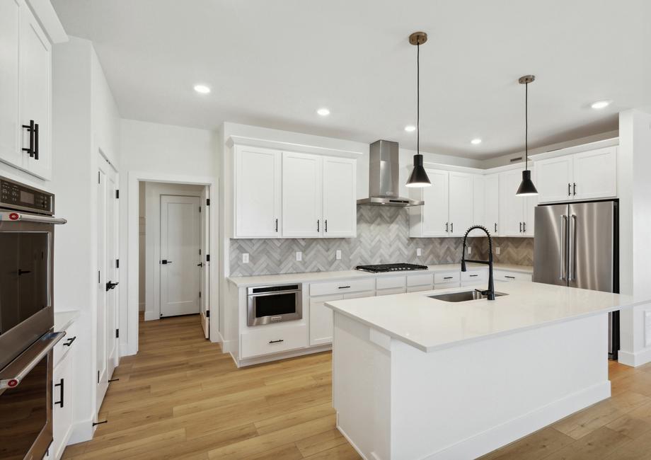 The kitchen has beautiful stunning tile backsplash.