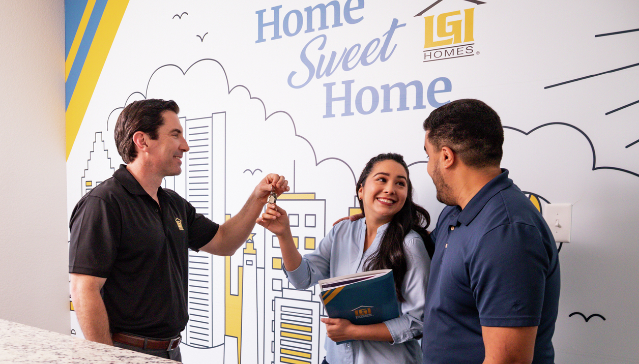 A couple receives the keys to their new construction home