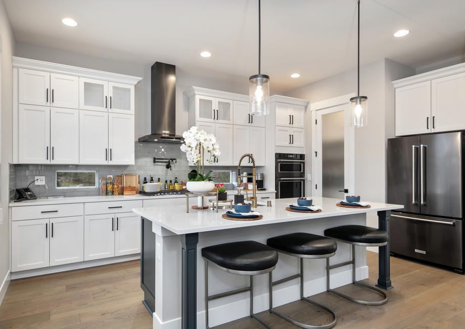 Chef-ready kitchen with quartz countertops and matte black hardware.