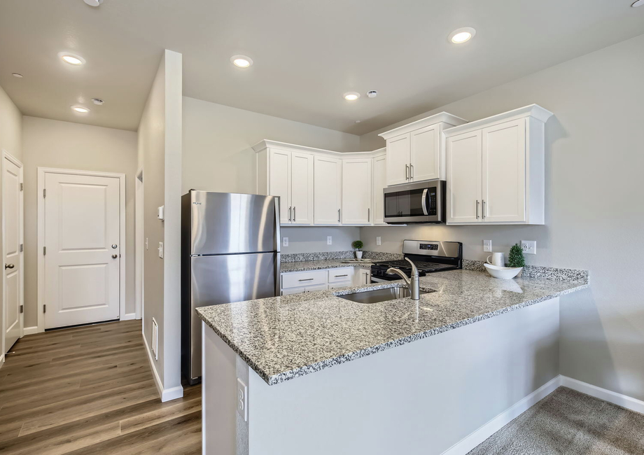 The kitchen has stainless steel appliances and is chef ready.