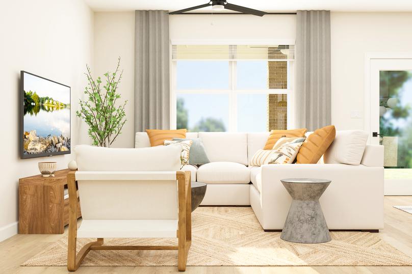 Rendering of the open layout family room
  featuring modern furniture and large windows that let in natural light.