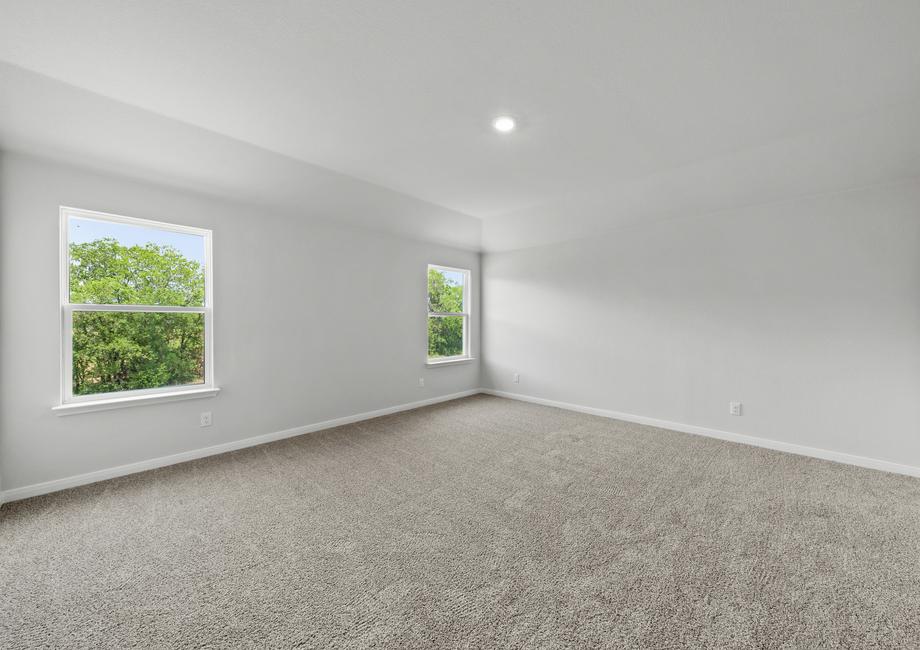 The master bedroom of the Juniper has  two large windows that let in great, natural light.