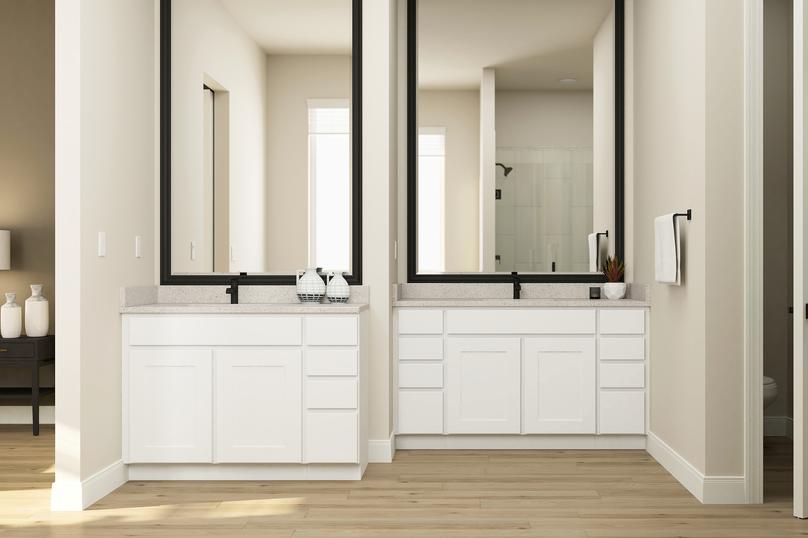 Rendering of the large master bath in the
  Primrose plan showcasing the two separate vanities with white cabinets and
  black fixtures.