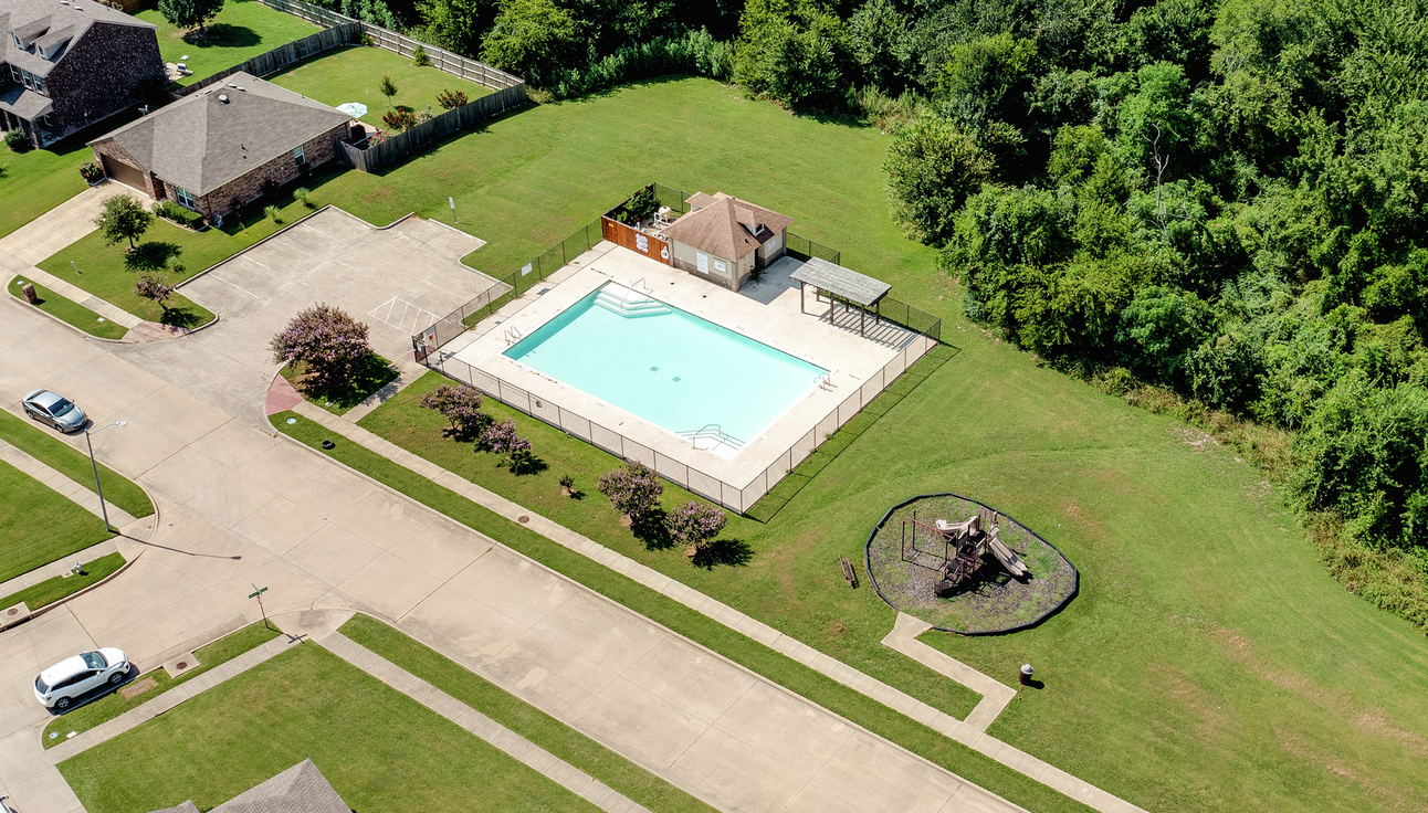 Overview of the pool and playground at Creekside Estates.