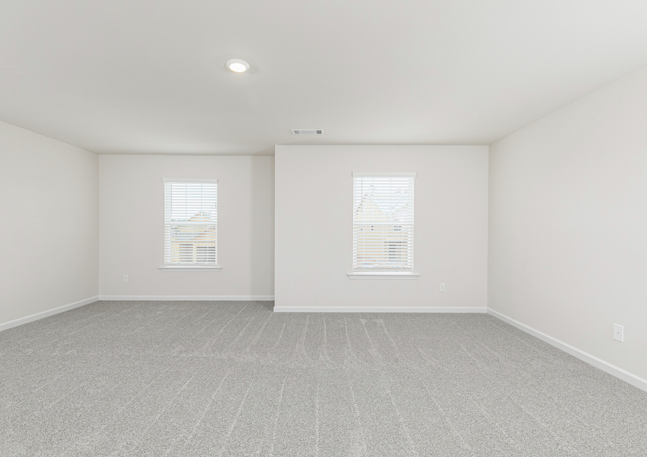 Rest and relaxation await in the master bedroom