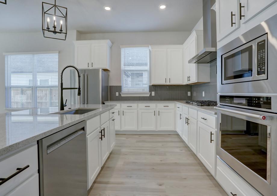 Chef-ready kitchen with stainless steel appliances and expansive counterspace.