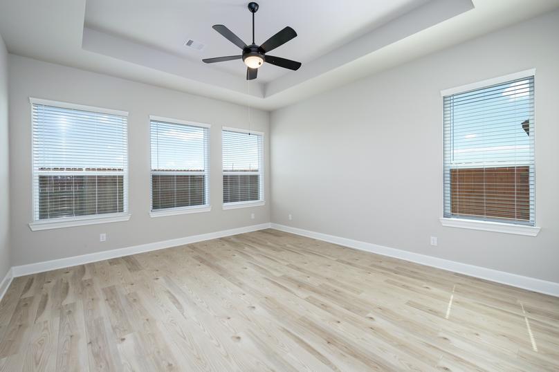 You will love ending your day in the master bedroom with its gorgeous flooring and large windows.