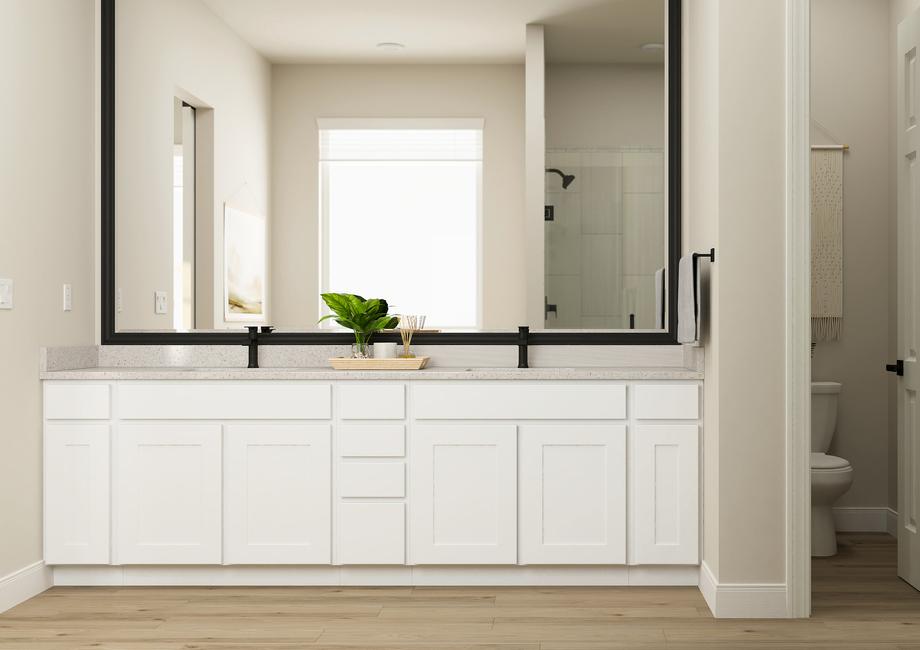 Rendering of the spacious master bath in
  the Laurel floor plan. The double-sink vanity has white cabinetry and matte
  black fixtures. The water closet is visible through an open door.
