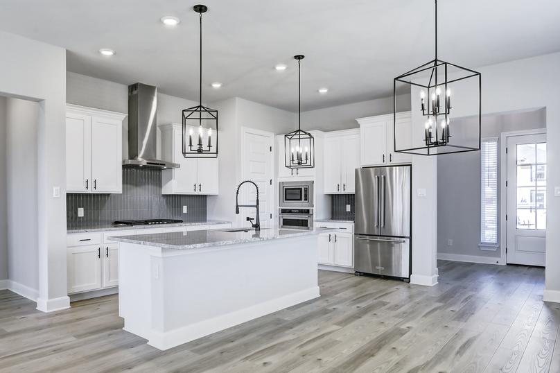 Fully-equipped kitchen with top-tier appliances and an oversized island.