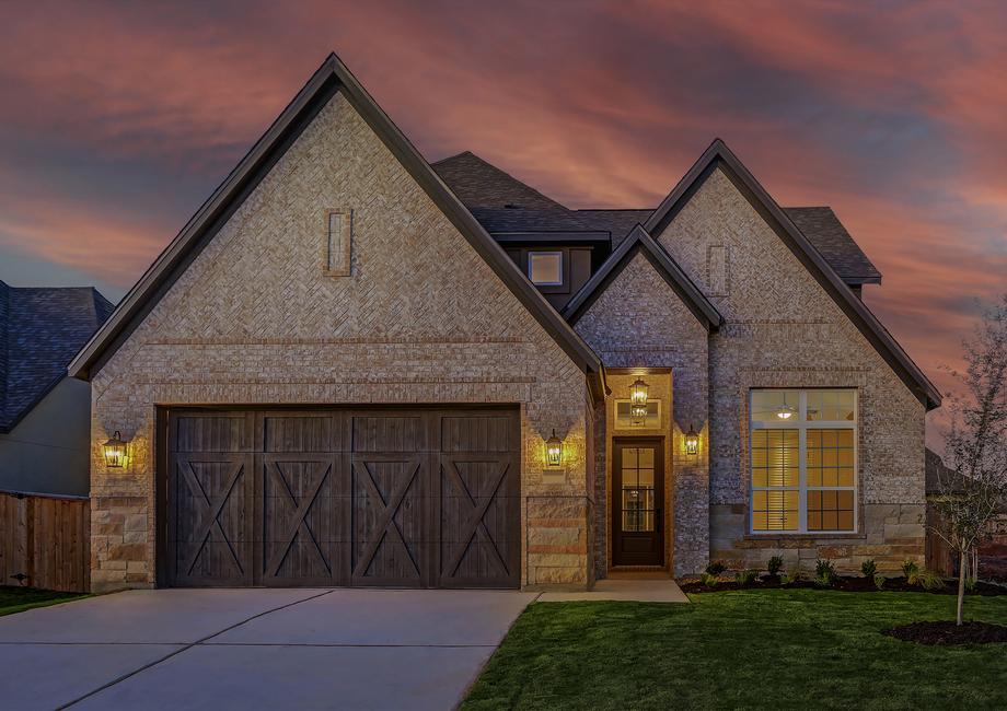 Exterior of the Welch with designer light fixtures and a two-car garage.