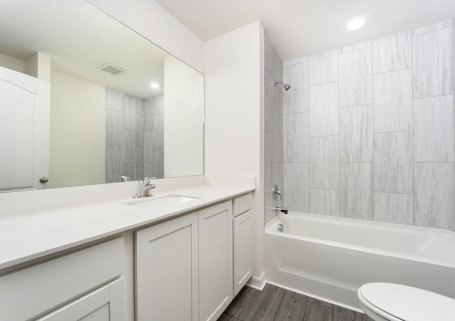 Spacious counterspace is featured in the master bathroom