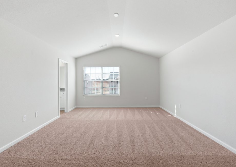 The master bedroom has lots of windows to let in natural light