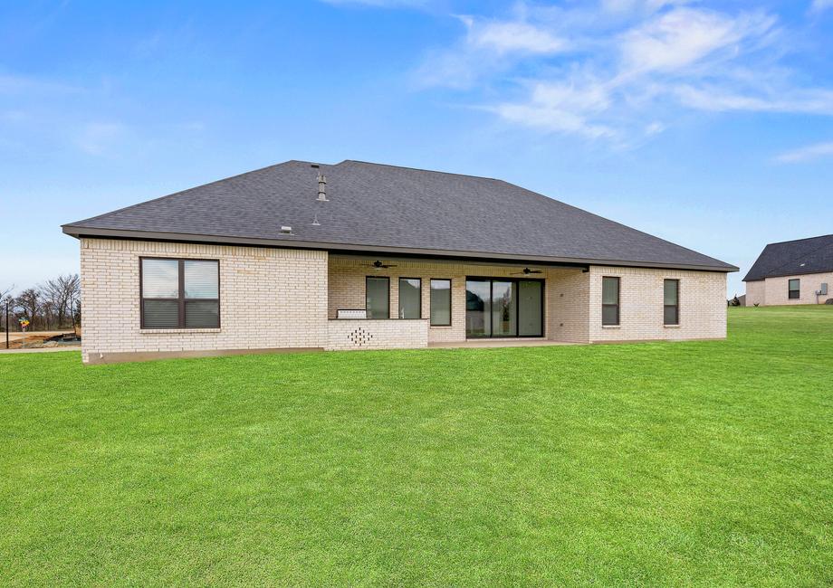 The Mantle II has a gorgeous back yard that includes a covered patio with an outdoor kitchen.