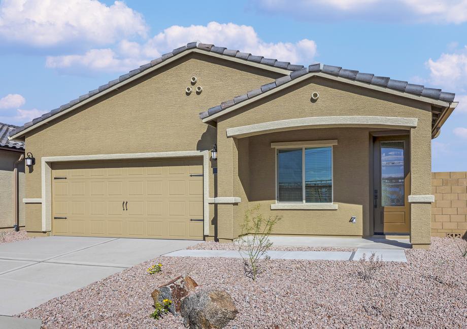 Angled exterior of the Taos with desert landscaping and a covered front porch.