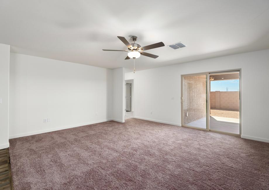 The living area is spacious and opens up to the backyard.