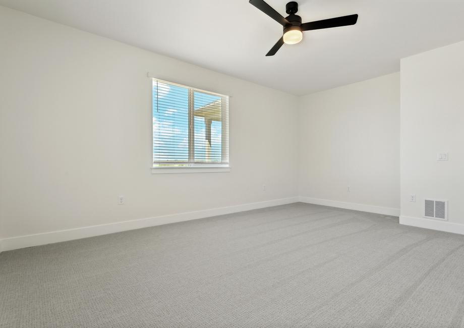 The master bedroom has large windows that let in great, natural light.