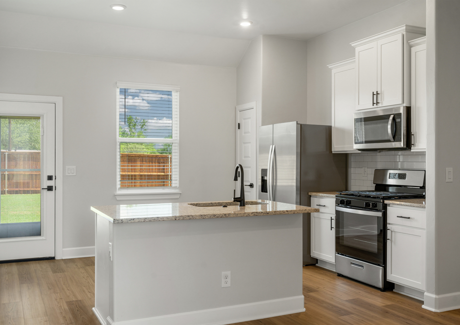 The beautiful kitchen has a large window that lets in great natural light.