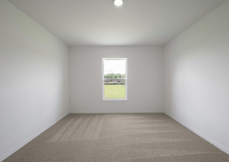 The master bedroom has its own walk-in closet and bathroom.