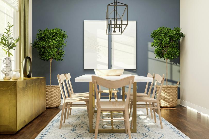 Rendering of a dining room showing a
  large gold media cabinet on the left and a large dining table with chairs
  centered under a metal light fixture in front of a blue accent wall with dark
  wood look flooring throughout.