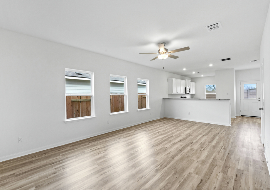 A spacious family room with three windows