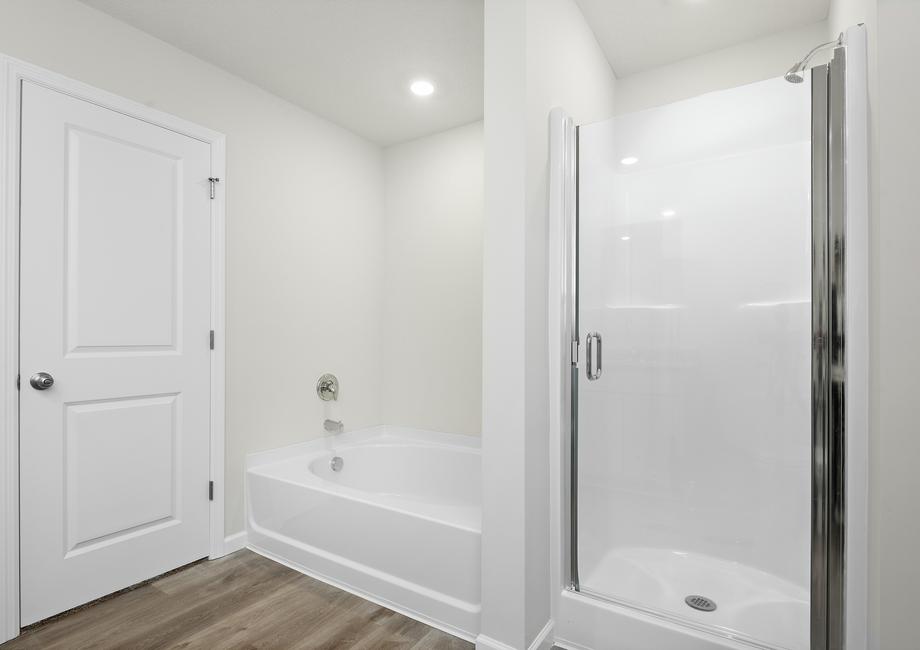 The master bathroom also has a step in shower and soaking tub.