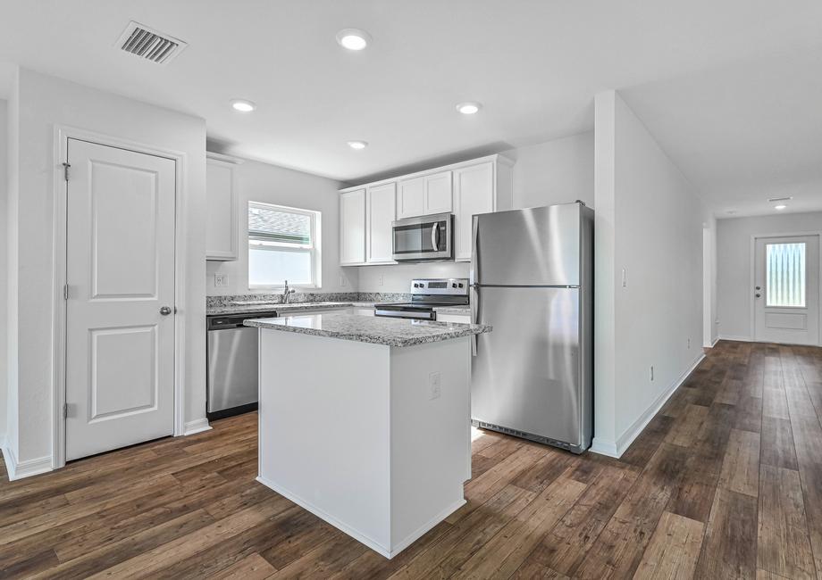 The kitchen is chef ready with stainless steel appliances