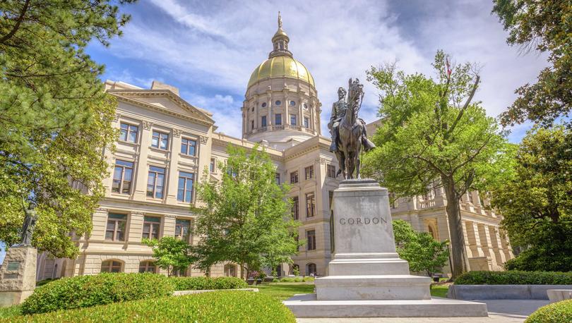 Atlanta, Georgia State Capitol building with gold-topped dome, statue of John B. Gordon in the front, and beautifully landscaped grounds