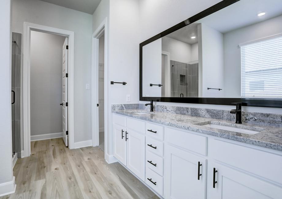 Relaxing master bathroom with a dual-sink vanity, walk-in shower, and soaking tub.